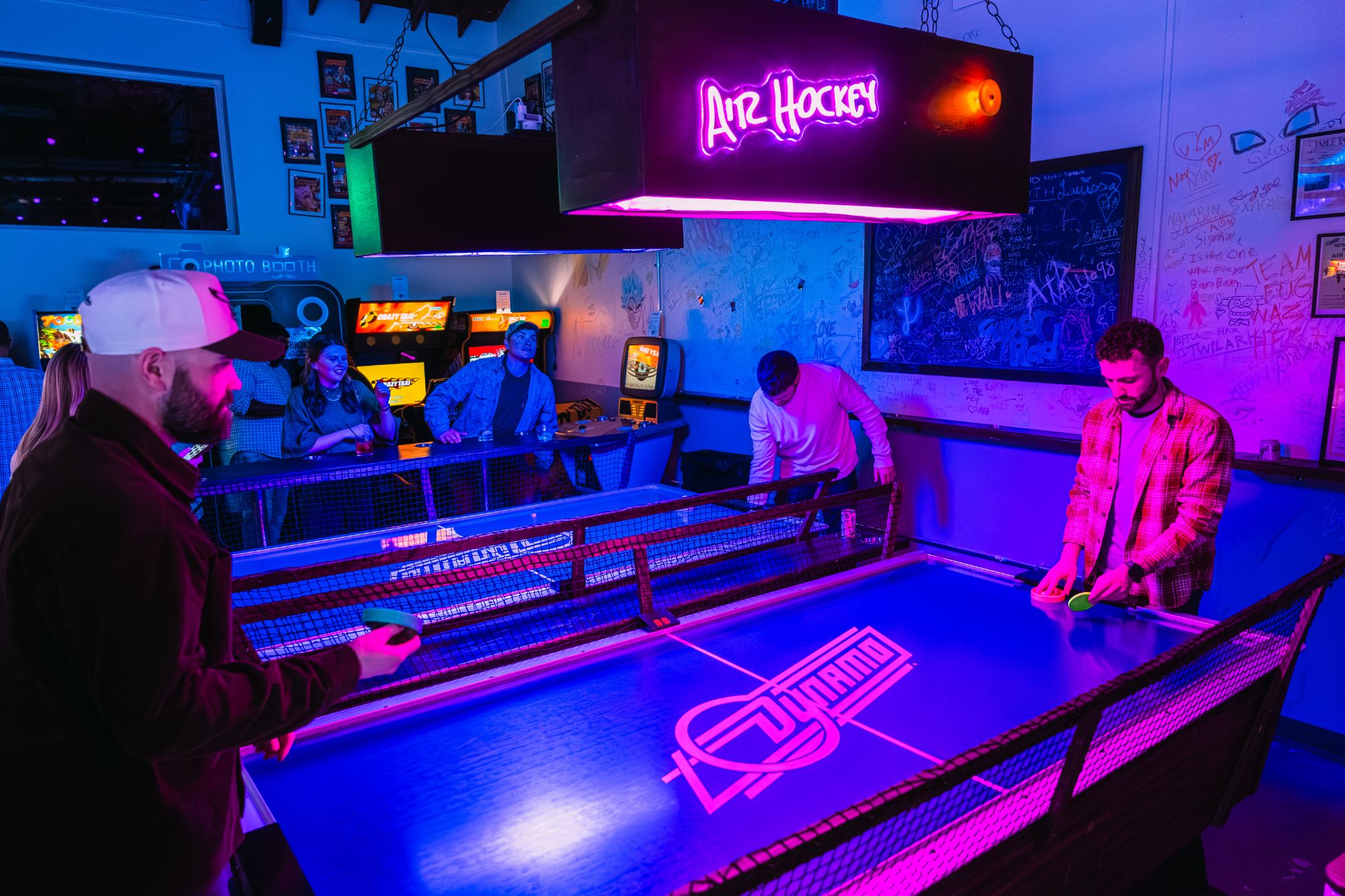 Groups enjoying the arcade and event atmosphere at Super Rad Retro Lounge