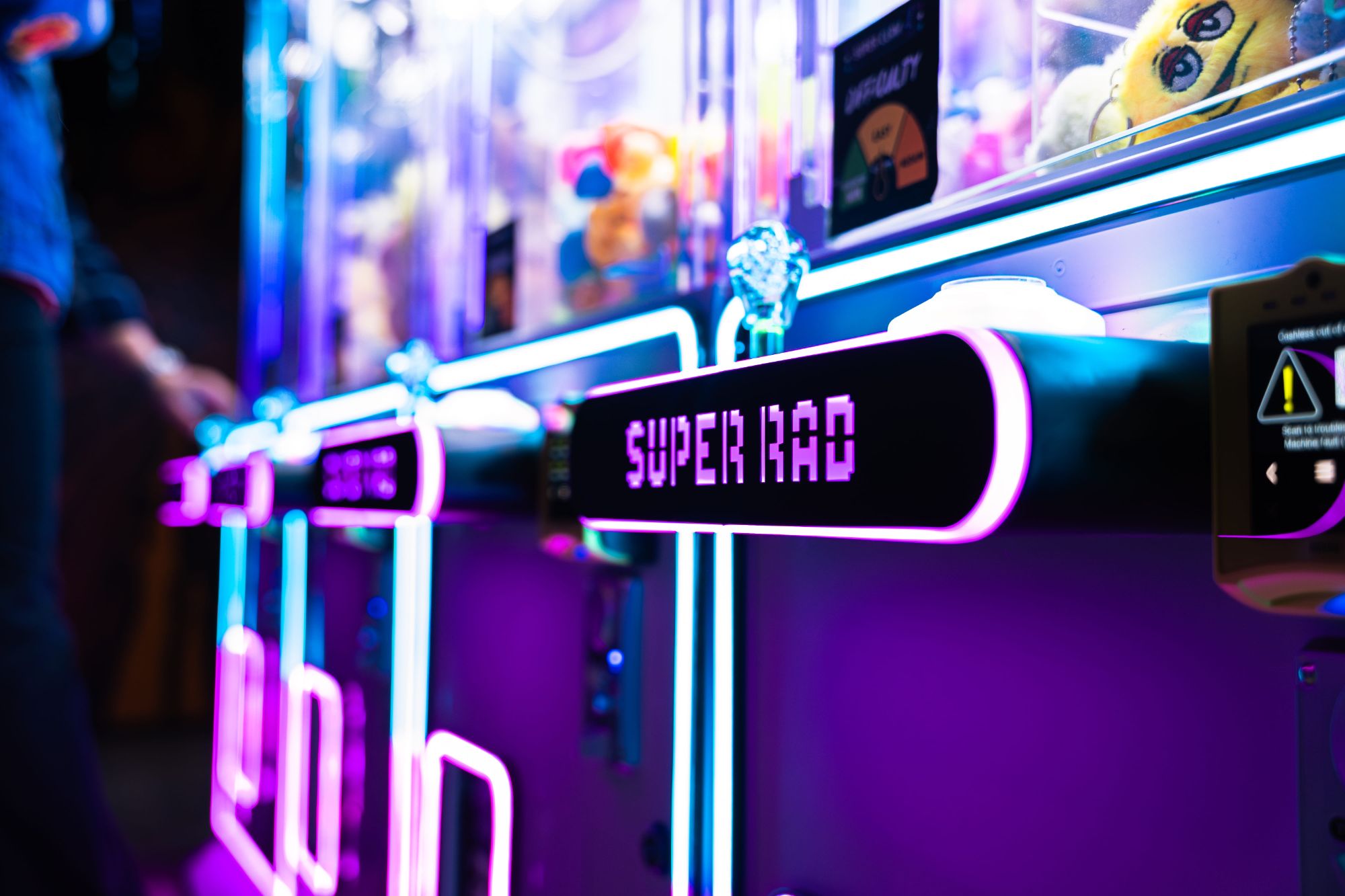 Retro arcade games and neon lights at Super Rad Raleigh