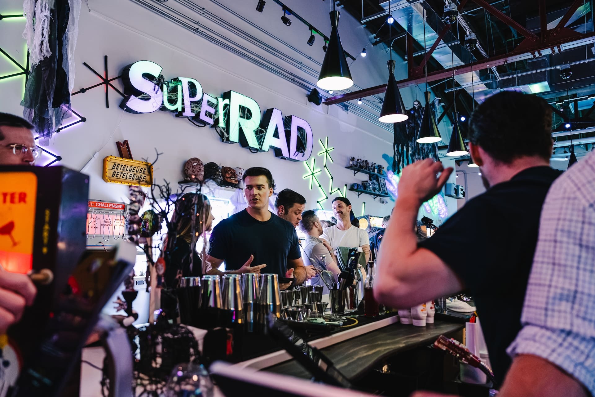Guests enjoying the neon bar at Super Rad Raleigh