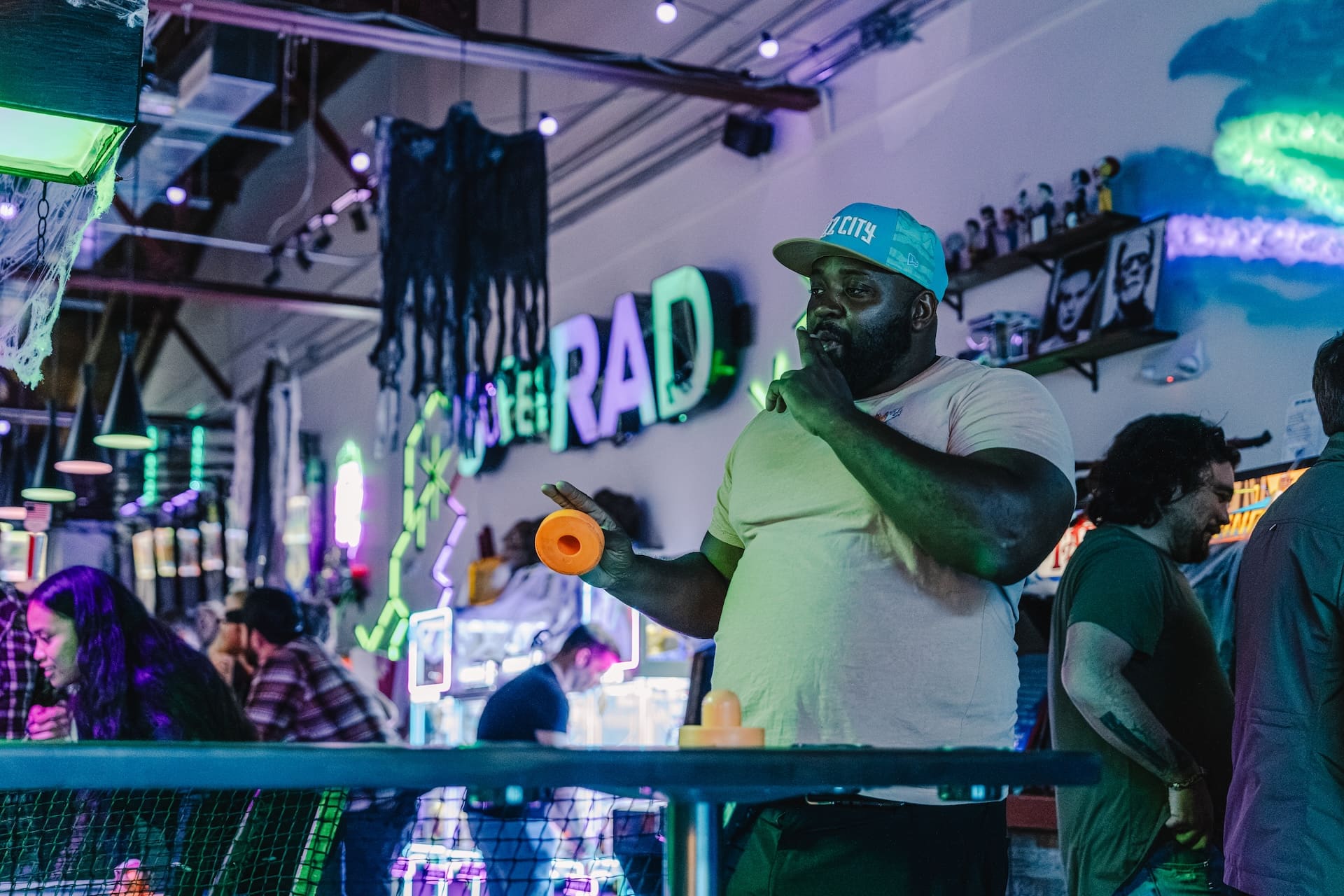 Air hockey player celebrating a win at Super Rad Raleigh